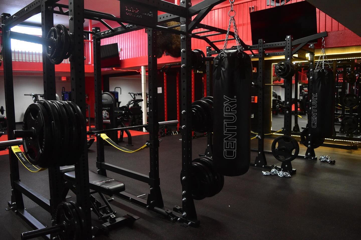 Power racks and heavy bags in the functional training area
